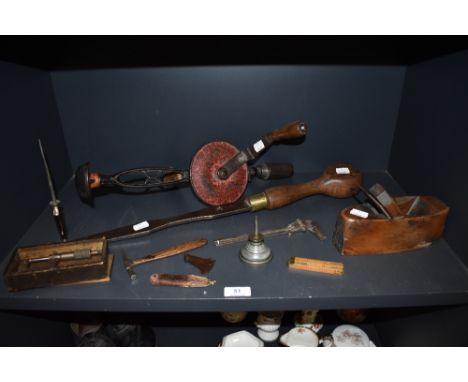 A selection of vintage hand tools including beech block plane etc