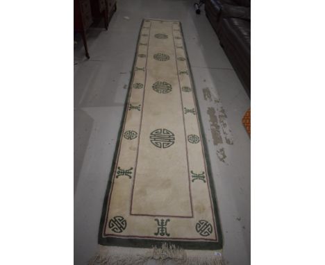 A modern Oriental carpet runnerapprox 70 wide x 390 long