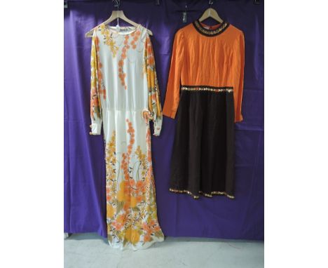 Two vintage maxi dresses, one by Jean Allen, having bright floral print and open sleeves down to the cuffs, the other by Biji