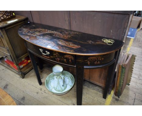 A reproduction black lacquered and gilt chinoiserie console type table, 121cm wide. 