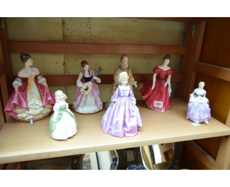 Three Royal Doulton figures, comprising 'Winsome', HN2220; 'Penny', HN2338, (second); and 'Southern Belle', HN2229; together 