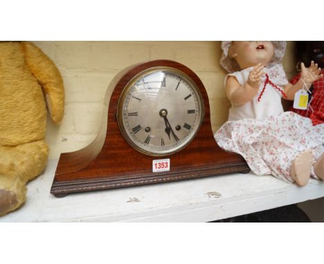 A 1920s mahogany Wellington clock, 37cm wide. 