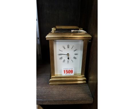 A good brass carriage clock, striking on a bell, height including handle 17cm. 