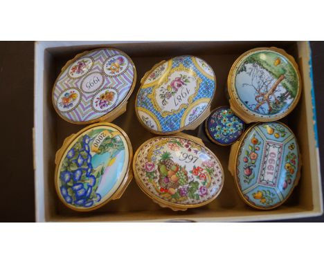 Seven various Halcyon Days enamel snuff boxes, to include a Winnie the pooh box.