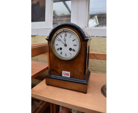 A late 19th century walnut and ebonized dome top mantel clock, the bell striking movement inscribed 'Marti', 24.5cm high. 