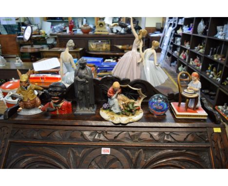 A mixed lot, to include: a metal knight table lighter; a cast iron money box; and a Royal Doulton Bunnykins teapot and cover.