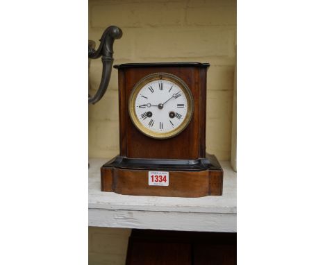 A late 19th century walnut and ebonized mantel clock, 20.5cm high. 
