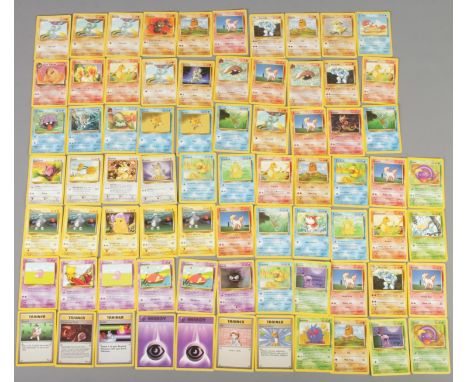 A quantity of Pokemon cards. Includes base set, jungle, fossil, Team Rocket, base set Charmander, Pikachu, etc. 74 cards in t