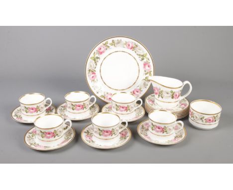 A Royal Worcester "Royal Garden" pattern part tea set. Comprising of six cups, saucers, side plates, milk and sugar bowl and 