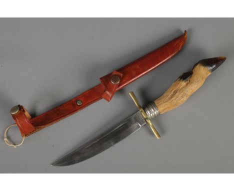 A Jowika Solingen hunting knife with hoof handle and leather scabbard. Length of blade: 12cm. CANNOT POST OVERSEAS  