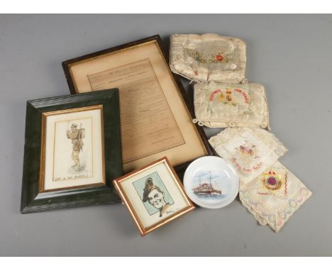 A selection of embroided French souvenir handkerchiefs and pin cushions along with a framed French certificate of good conduc