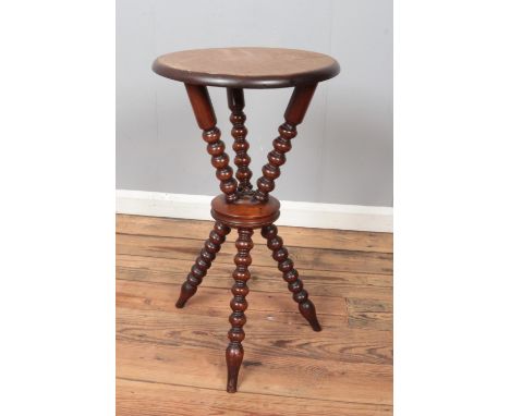 A mahogany Gypsy table with bobbin turn supports.  