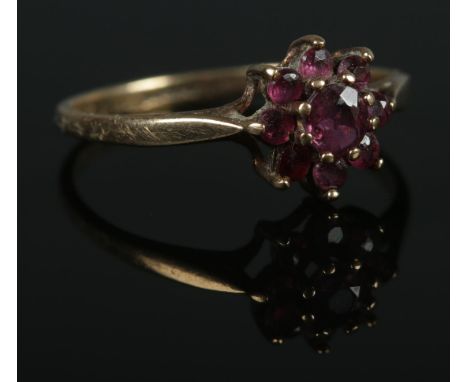 A 9ct Gold and ruby cluster ring. Size M. Total weight: 1.3g  