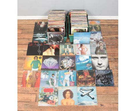 Two large boxes of rock and pop vinyl LP records, including Status Quo, Rolling Stones, Bon Jovi, Madonna, The Undertones and