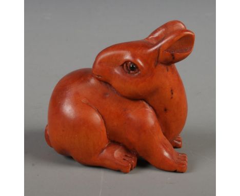 A Japanese carved Netsuke in the form of a rabbit.  