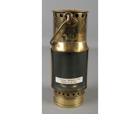 A brass miners lamp with outer brass case. Marked 13.  