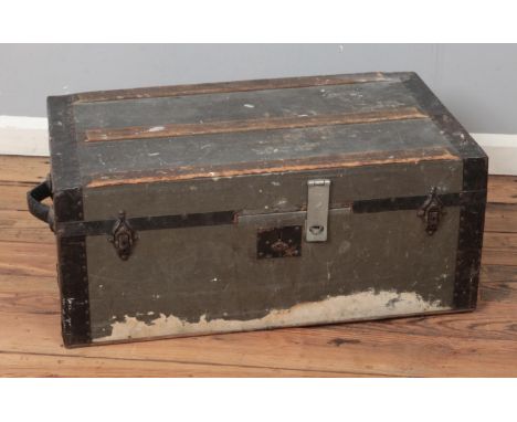 A vintage wooden bound luggage trunk.  