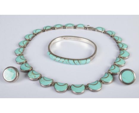 A silver and turquoise three piece jewellery suite. Includes necklace, bangle and earrings. 120g gross weight.  