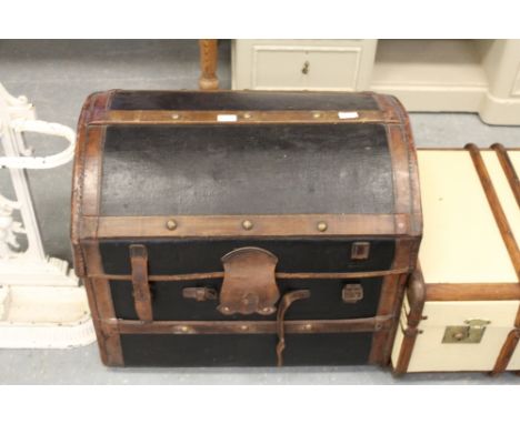 Domed leather and canvas trunk