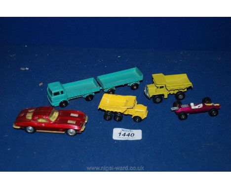 Five Lesney model vehicles.