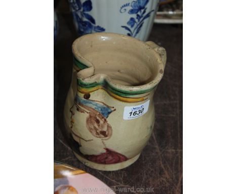 A hand made pottery Jug possibly an Ale Jug with a gentleman's Portrait as decoration