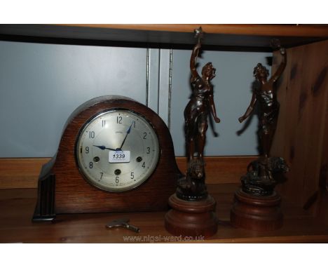 A pair of Spelter figures and a Smiths mantle Clock with key