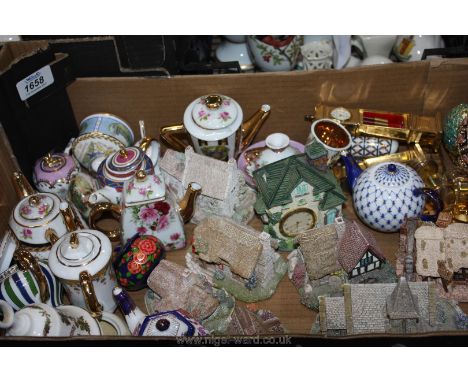 A quantity of Lilliput Lane houses, church, etc., miniature teapots, Royal Worcester Christmas Bell, etc