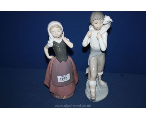 Two Nao figures, one being a young girl, 9 3/4'' tall and a young boy carrying a lamb over his shoulder