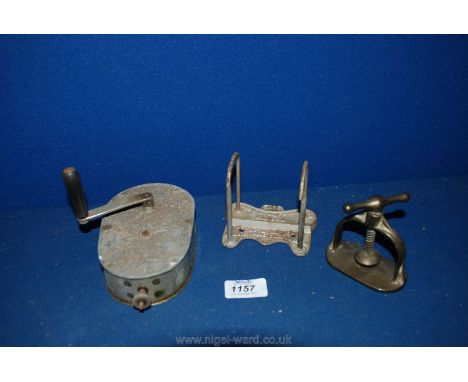 Three old gadgets including a Shannon File, Nutcracker and 'The Macaura Vibrator'