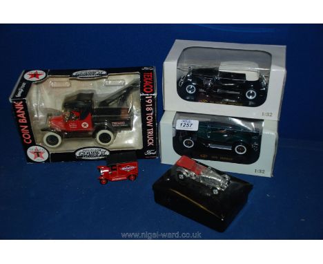 A die-cast model of 1933 Cadillac Fleetwood (scale 1:32), a 1930 Hudson (scale 1:32) and a 1918 Ford Texaco Petroleum to Truc