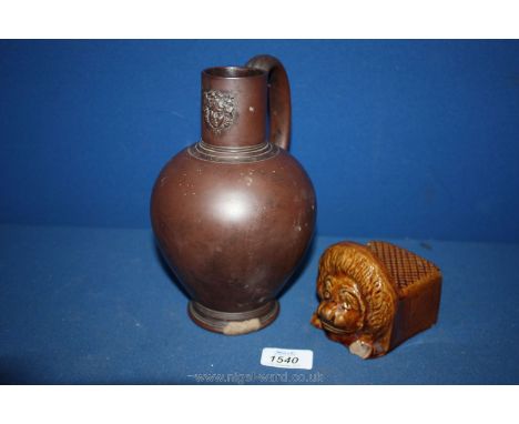An attractive 19th century mask jug, impressed cyphers to base, repaired chip to foot rim and an early 19th century Rockingha