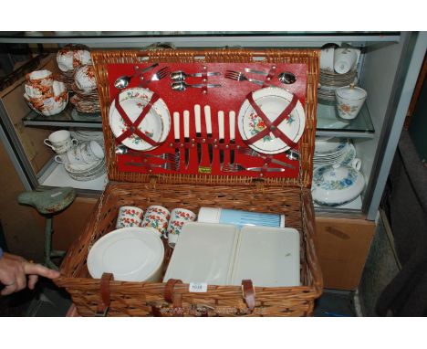 A Wicker Picnic Hamper by Brexton complete with original china teacups, saucers and tea plates for six and various storage bo