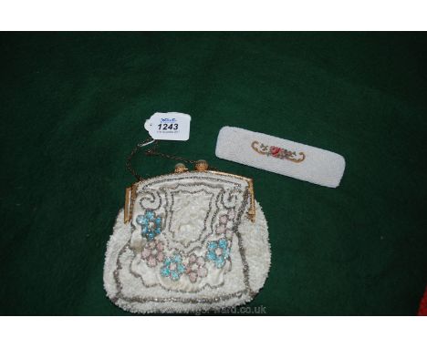 A lady's beaded evening purse, early 20th century, and an attractive beaded comb case labelled 'Hand Made in France'.