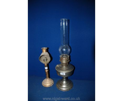 A chrome Oil Lamp together with an old fashioned Lamp