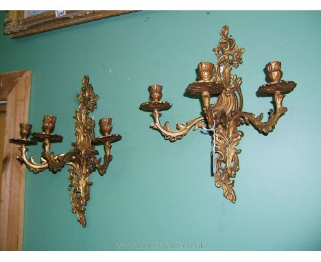 A good pair of gilded bronze wall lights cast as flowering bouquets in the Louis XV style, probably Italian mid 20th century,