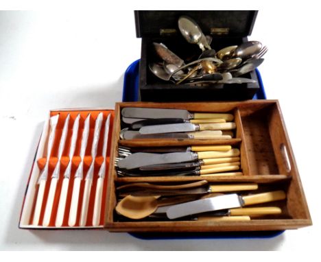 A 19th century ebonised table box together with a wooden cutlery caddy containing a quantity of stainless steel and plated fl