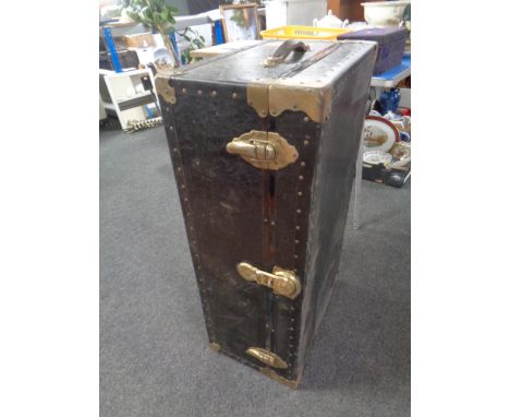 An early 20th century metal bound shipping trunk 