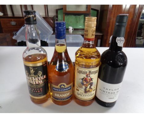 Five various bottles of alcohol including Captain Morgan, Prince Consort brandy, Taylor's port, Benriach single malt scotch 