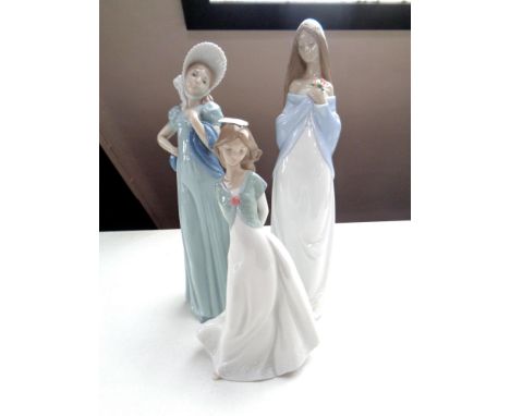 Three Nao figures of girls