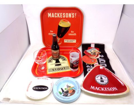 A quantity of Mackeson brewery related items, two tin trays, ceramic and plastic ashtrays, bottle of stout, beer mats etc 