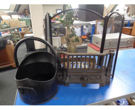 A three-way folding spark guard together with a coal bucket and a cast iron fire front with grate.