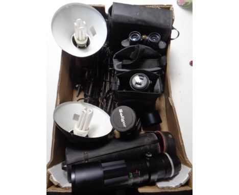 A box of angle poise lamps, Panasonic Lumix camera, Filmpost 12 x 50 field glasses, Soligor telescopic lens 