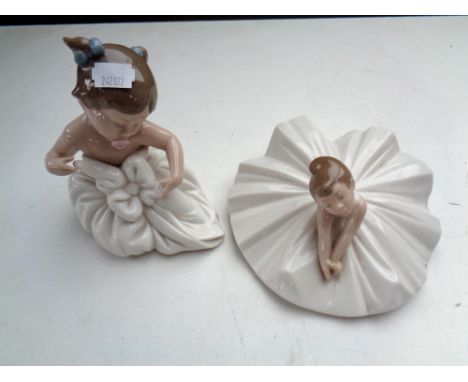 A Nao figure of a ballerina and further figure of a baby in dress 