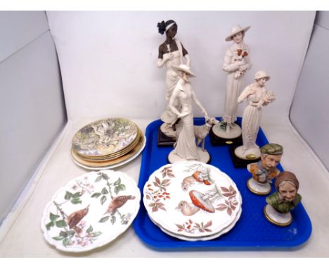 A tray containing four Giuseppe Armani Art Deco figures together with a pair of further china busts, collector's plates by Ro