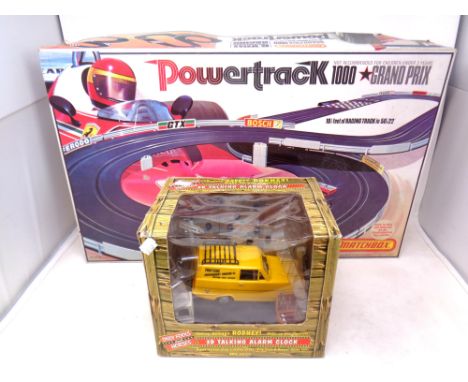 A Matchbox Powertrack 1000 Grand Prix together with an Only Fools and Horses 3d talking alarm clock 