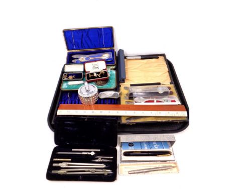 A tray of rulers, hip flask, Colibri lighter, boxed cutlery, pens etc 