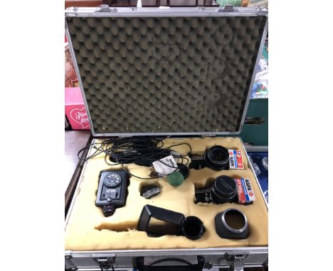 An aluminium camera case containing Pentax Spotmatic camera, Pentax ME Super, lenses, flash etc 