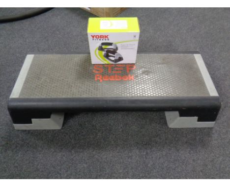 A Reebok fitness step together with a pair of boxed York fitness push-up stands. 