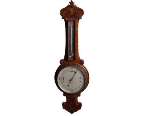 A late Victorian carved cased banjo aneroid barometer with thermometer, h: 83cm