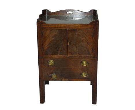 A George III mahogany night commode with tray top above cupboards and slide compartment with aperture for pot, 80cm high 